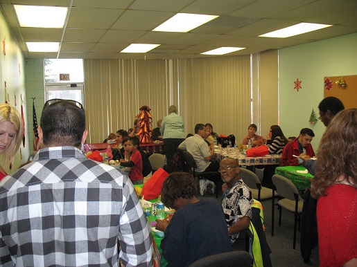 Everyone is enjoying the lunch at the Christmas party